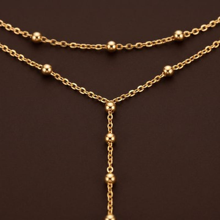 Layered Gold Necklace with Beaded Chain in gold
